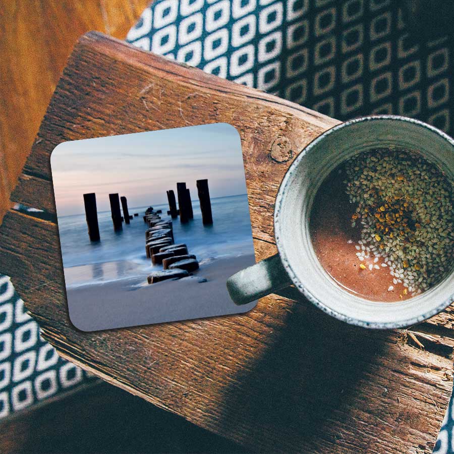 Onderzetter - Golfbreker op het strand