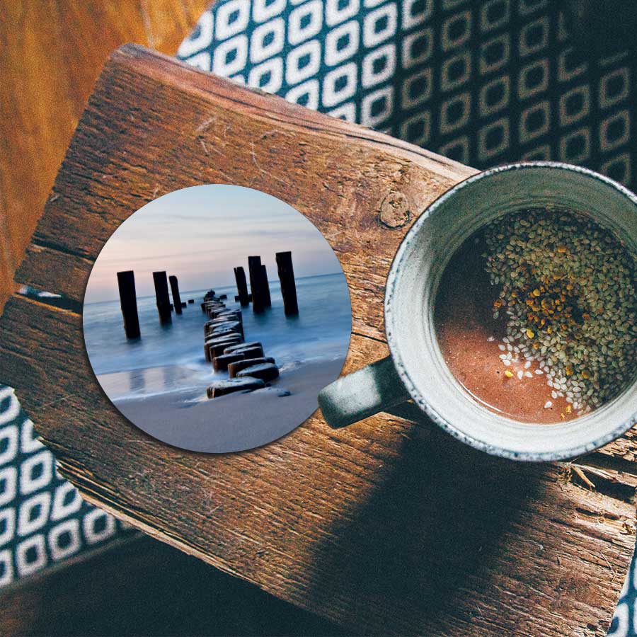 Onderzetter - Golfbreker op het strand